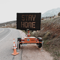 Image of Stay Home road sign