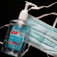 Image of hand sanitizer and surgical mask